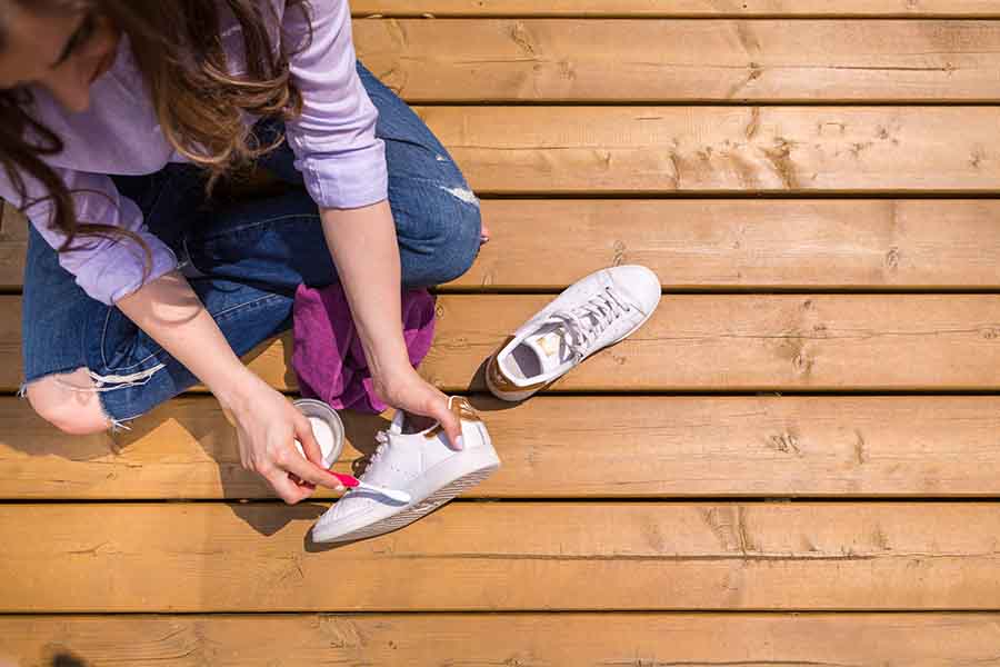 Melissa cleaning shoes