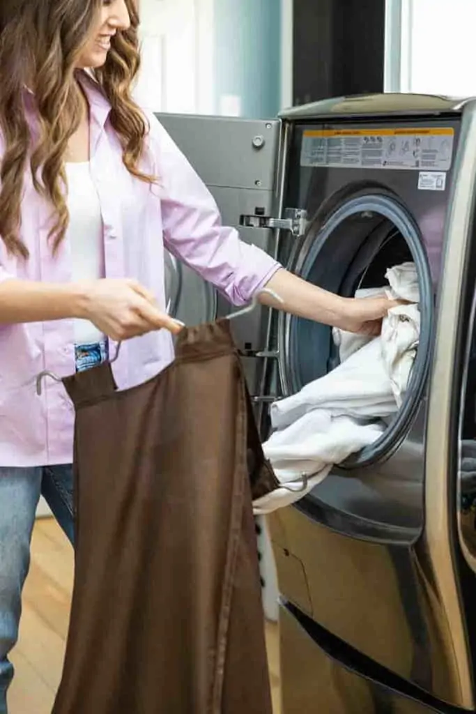 Melissa loading the washing machine